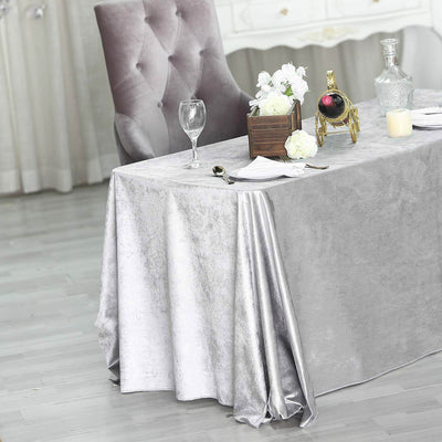 Elegant grey tablecloth draped over a table, enhancing a stylish dining setup.