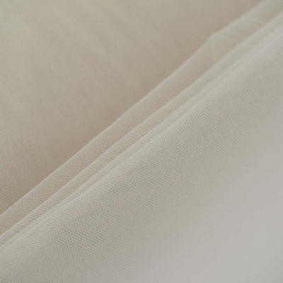 Close-up of soft, textured fabric in neutral tones.