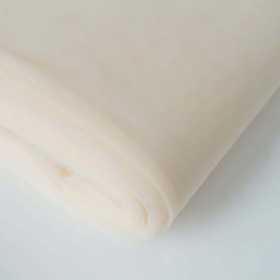 Pale peach fabric roll on a plain white background