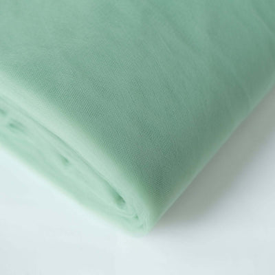 Mint green fabric roll on a white background