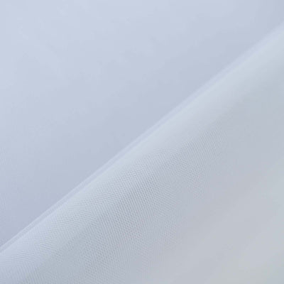 Close-up of textured white fabric with a subtle sheen.