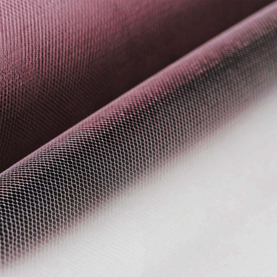 Textured fabric with a gradient effect in rich colors.