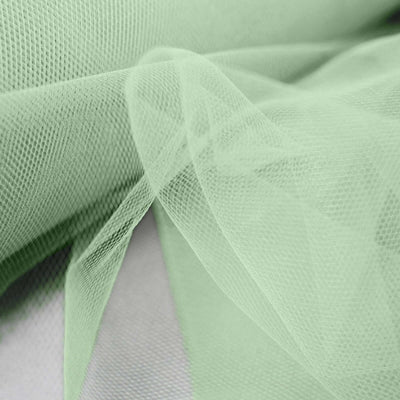 Light green tulle fabric draped elegantly in soft folds.