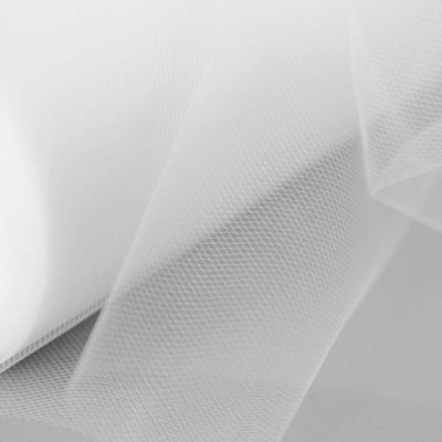 White tulle fabric with a soft, sheer texture.