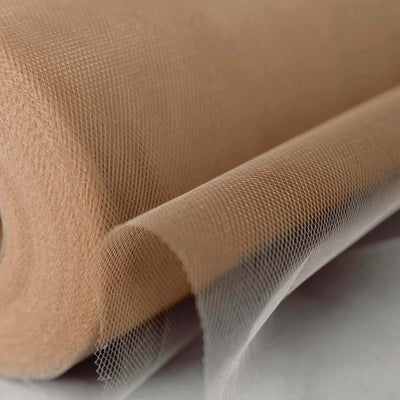 Beige tulle fabric roll showcasing fine mesh texture.