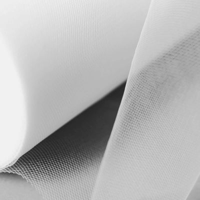 White mesh fabric roll showcasing texture and detail.
