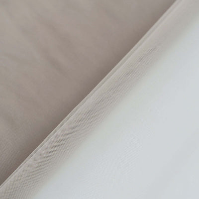 Layered fabric textures in neutral tones.
