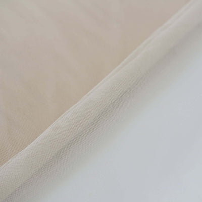 Beige fabric texture close-up with a white background.