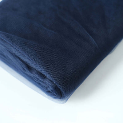 Navy blue fabric roll on a white background