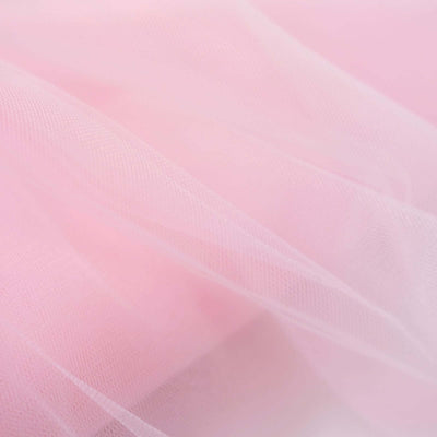 Soft pink tulle fabric with a delicate, sheer texture.