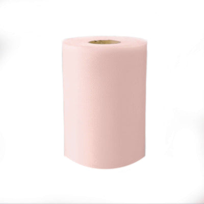 Pink disposable paper roll on a white background