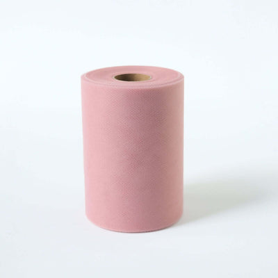 Pink textured paper roll on a white background