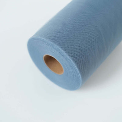 Roll of light blue tulle fabric on a white background