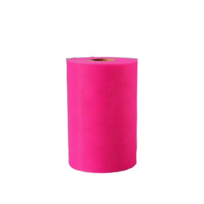 Bright pink roll of fabric on a plain white background