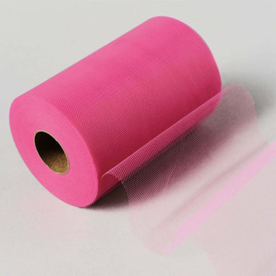 Pink tulle roll with a sheer finish, perfect for crafts and decorations.