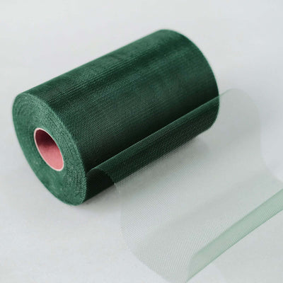 Green mesh roll on a plain backdrop for crafting and floral arrangements.