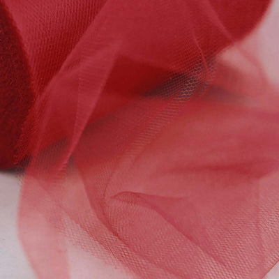 Red tulle fabric roll with soft, flowing layers