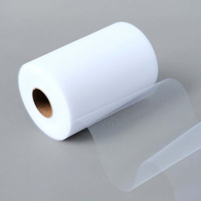 White mesh fabric roll on a gray surface