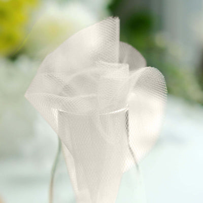 White decorative tulle ribbon in a soft, elegant bow