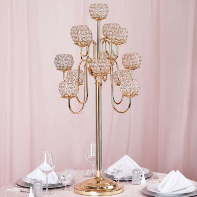 Elegant gold candelabra with crystal accents, perfect for table decor.