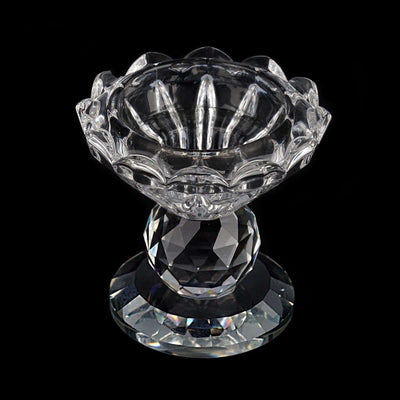 Crystal decorative bowl on a faceted pedestal, showcasing intricate details.
