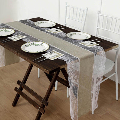 Elegant dining table setting with plates and lace runners.