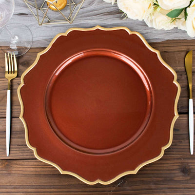 Elegant brown and gold scalloped dinner plate on a wooden table.