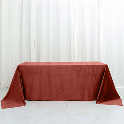 Rust-colored tablecloth on a plain backdrop