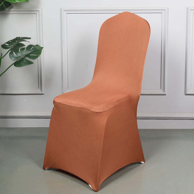Brown stretch chair cover on a chair in a stylish interior setting.