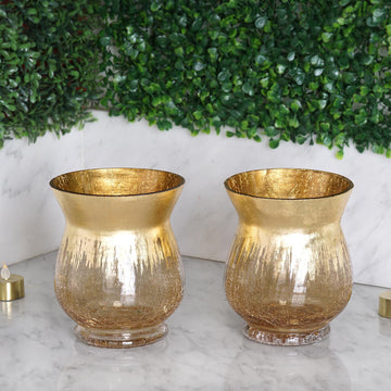 Experience the Beauty of Gold with the Gold Curvy Bell Shaped Crackle Glass Hurricane Vase