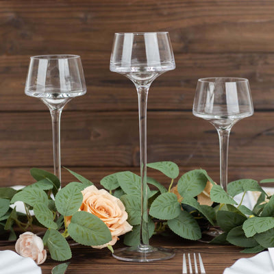 Elegant glassware set with floral decor on wooden table.
