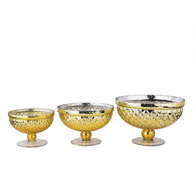 Set of three decorative gold glass bowls in varying sizes