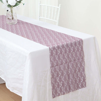 Lace table runner in mauve on a white tablecloth