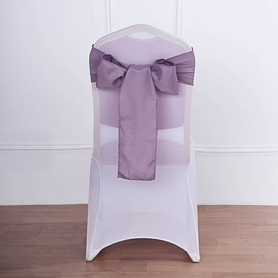 White chair with a purple satin bow on the back