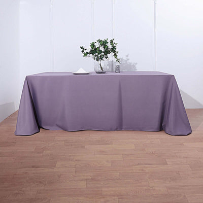 Purple tablecloth draped over a rectangular table.