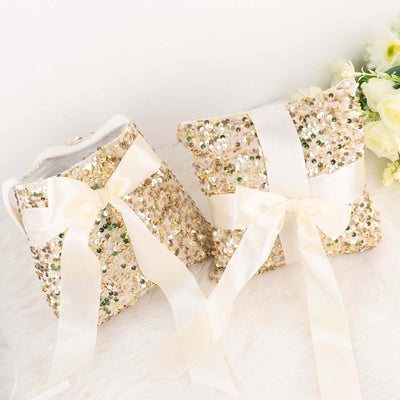 Gold sequin pillows with satin ribbons on a plush surface.