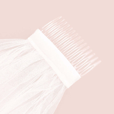 Sheer tulle hair accessory with comb for elegant hairstyles.