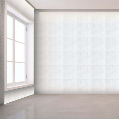 Textured white wall tiles in a modern interior setting.
