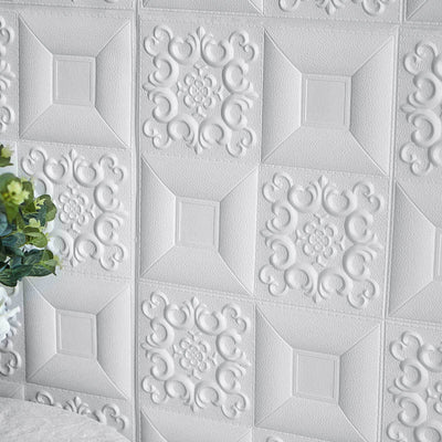 Textured white wall tiles with ornate designs and floral motifs.