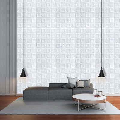 Modern living room with textured white wall, gray sofa, and pendant lights.