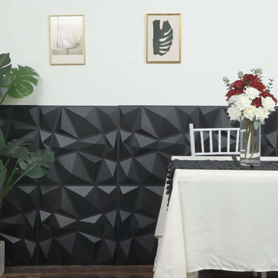 Black 3D wall panel design in a modern dining setting with decor elements.