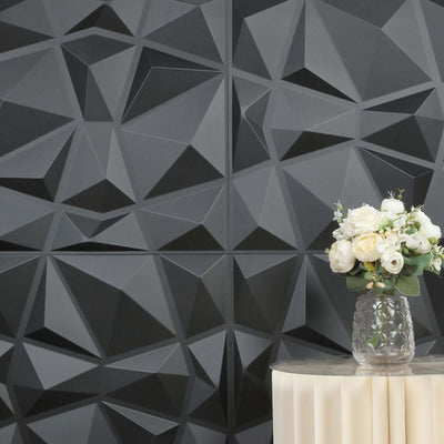 Decorative 3D wall panels with a vase of white flowers on a table.