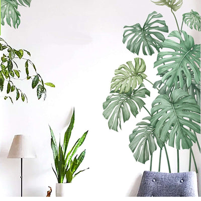 Indoor plant wall decals featuring tropical leaves in a modern living space.