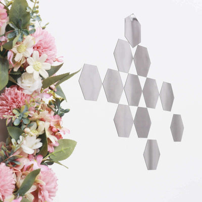 Decorative hexagonal mirror wall art with floral arrangement
