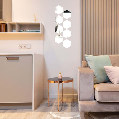 Decorative hexagonal mirror wall art in modern living room setting.