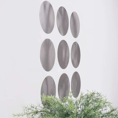 Set of modern oval wall mirrors in various sizes against a white background.
