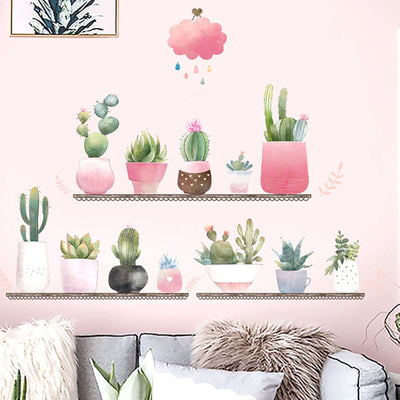 Colorful wall art featuring potted plants and cacti on shelves.