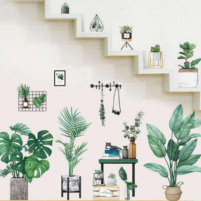 Stylish indoor plants decor on a staircase wall for home aesthetics.