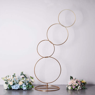Decorative gold circular stand with floral arrangements