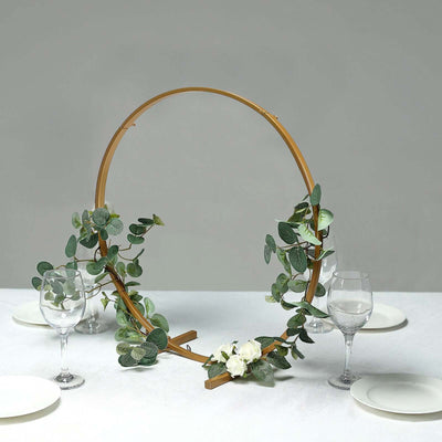Bamboo circle arch with greenery and flowers for table decor
